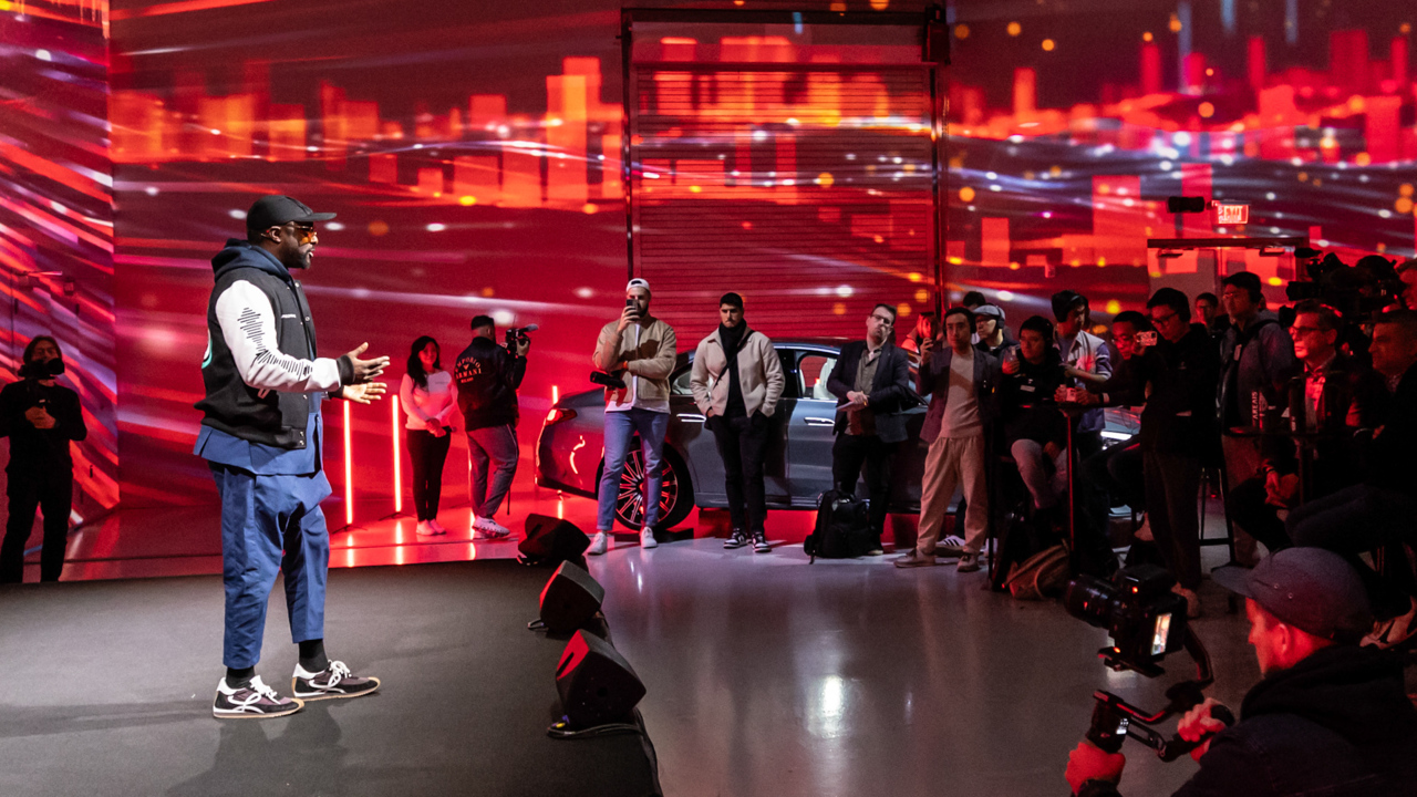 will.i.am, pictured explaining the new software, hopes tunes will emerge to adapt to different road conditions and scenarios, such as crawling along in urban traffic